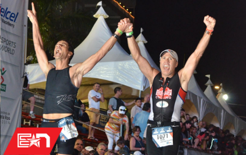 Two Team Endurance Nation members cross the finish at the same time. You too can finish an Ironman, but it all starts in the OutSeason.